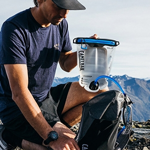 Man with hydration bladder with zipper.